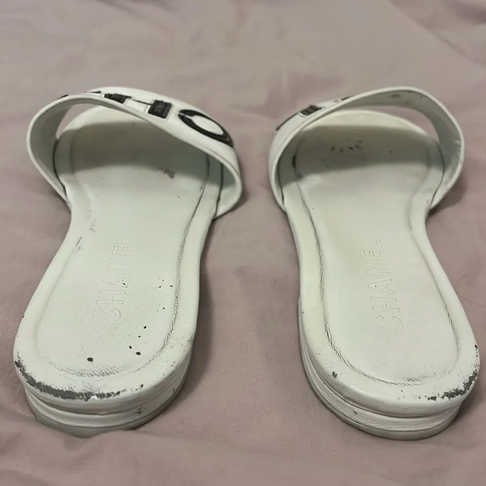 CHANEL White Slides with Black Lettering